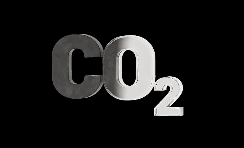 Об’ємні літери та цифра, що формують позначення CO₂ у чорно‑сріблястому стилі