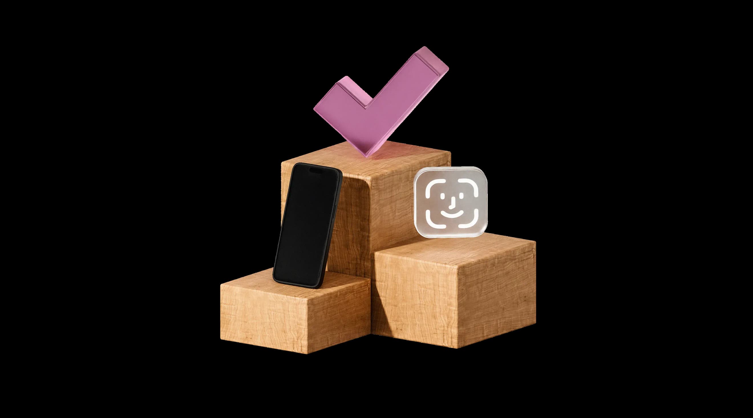 Смартфон, великий рожевий чек‑маркер і значок розпізнавання обличчя на дерев’яних кубах