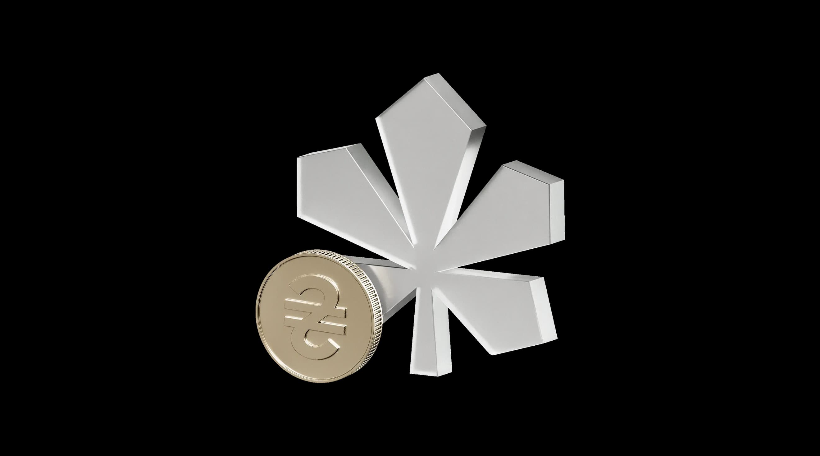 Металевий символ каштана поруч із монетою